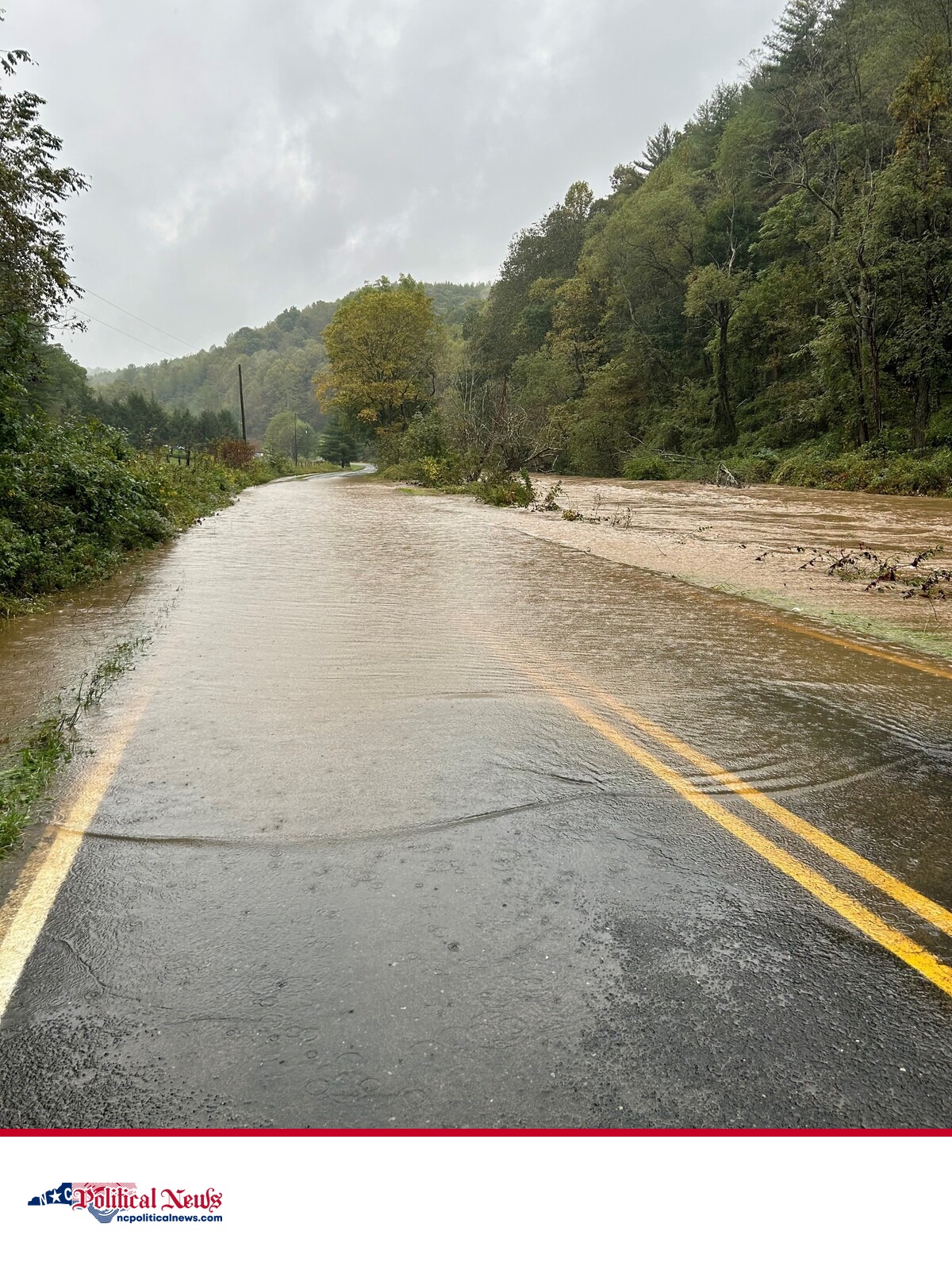 Floodwater covers a two-lane road in western North Carolina after Tropical Storm Helene.