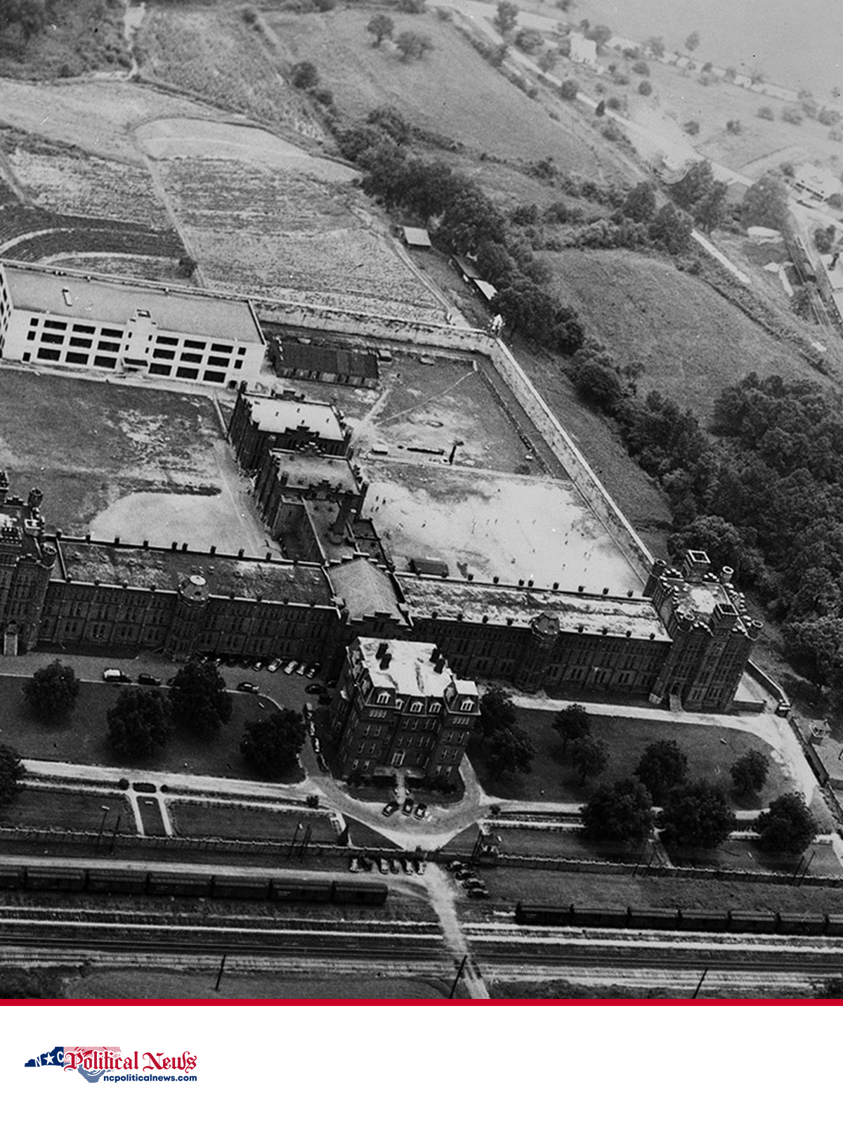 A 1949 aerial view of Central Prison in Raleigh above the NC Political News footer.