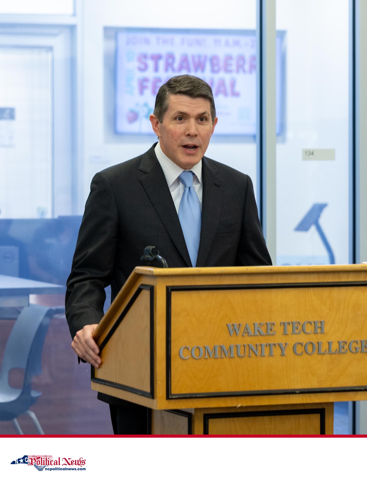 North Carolina Treasurer Brad Briner speaks at a Wake Technical Community College press conference above the NC Political News footer.