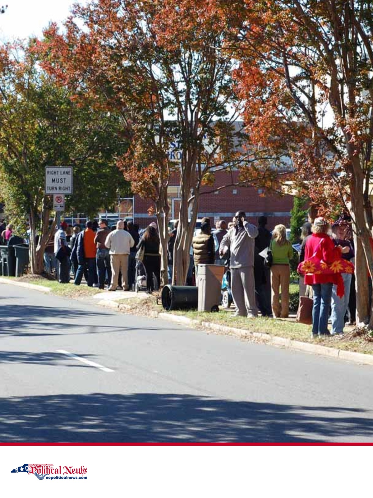 A file photograph of voters waiting in an early-voting line outside Plaza-Midwood Public Library in Charlotte.
