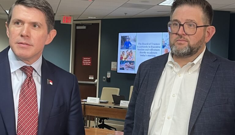  NC Treasurer Brad Briner and state Health Plan administrator Tom Friedman talk about insurance plan finances. (Photo: Lynn Bonner/NC Newsline) 